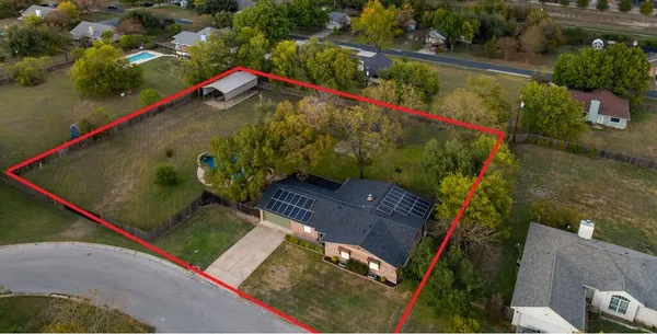an aerial view of a tennis ground