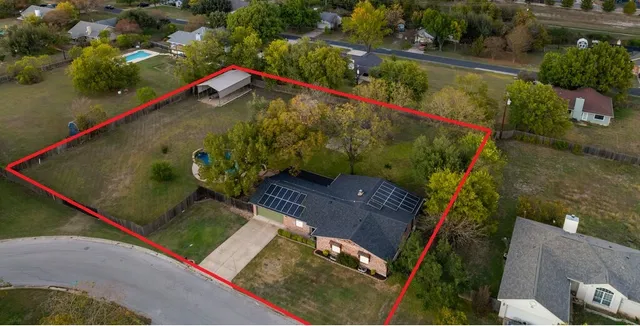 an aerial view of a tennis ground