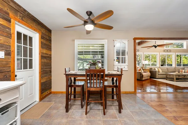 a dining room with furniture and window