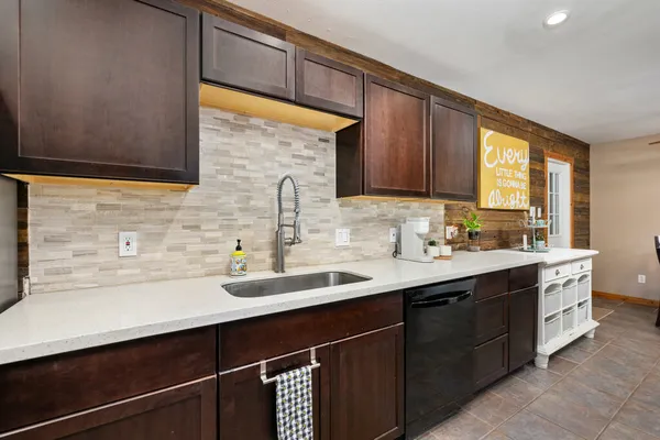 a kitchen with a sink and cabinets