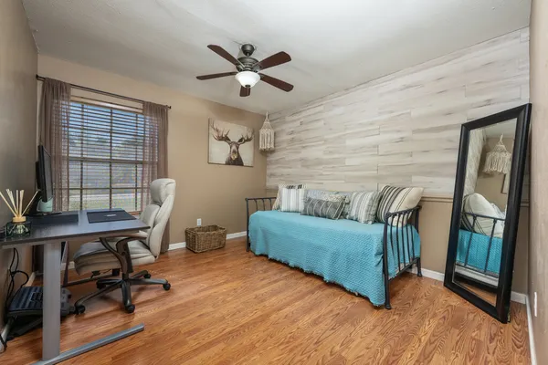 a living room with furniture and a window