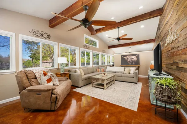 a living room with furniture and a large window