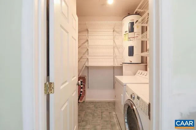 a bathroom with a double vanity sink and a toilet
