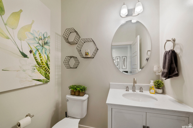 1836 Red Oak Road Eagle Mountain, UT 84005 - Photo 7 of 15 Half bathroom with toilet and vanity