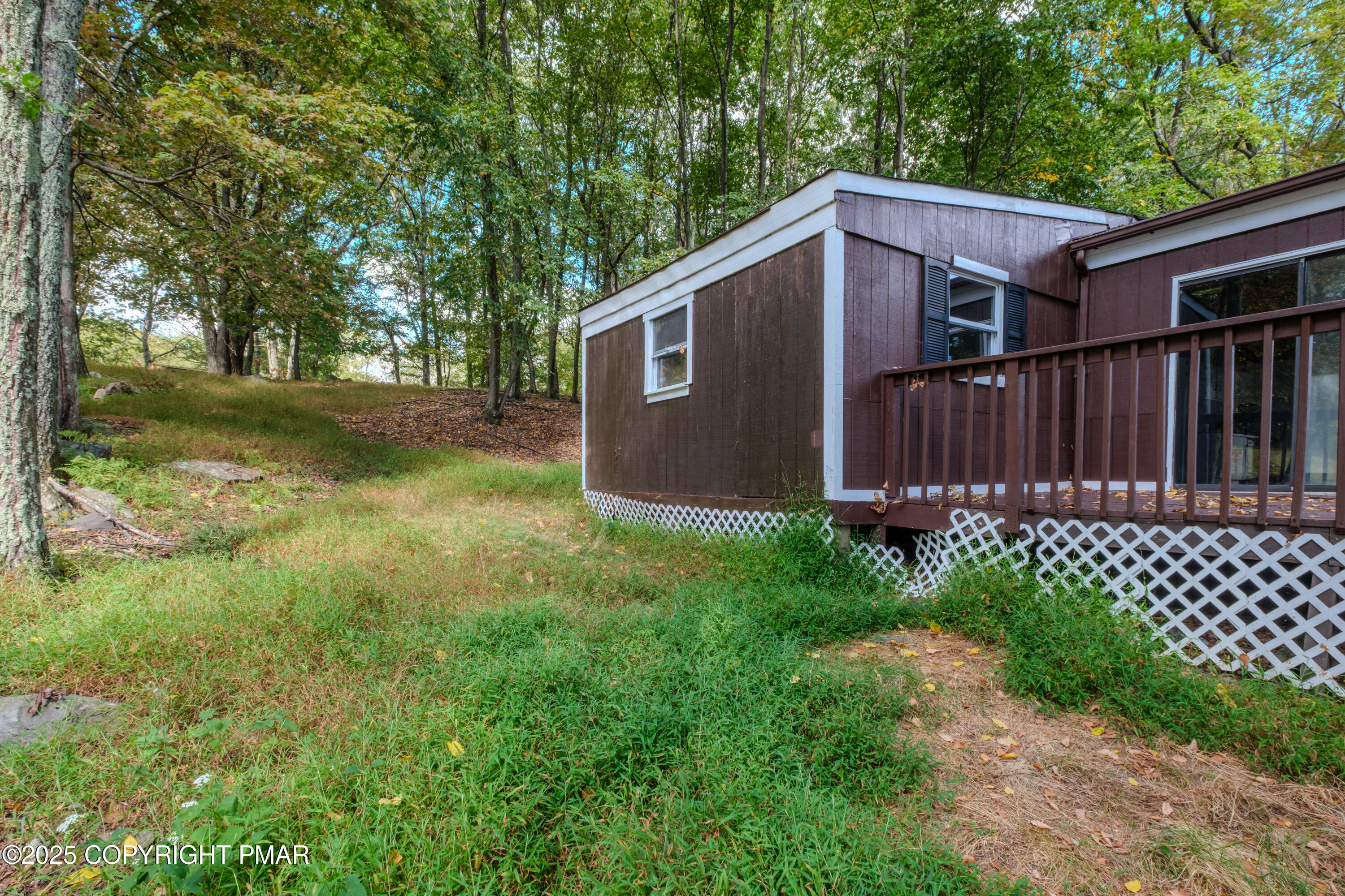 4774 Pine Ridge Drive West Bushkill, PA 18324 - Photo 13 of 36 a backyard of a house with lots of green space