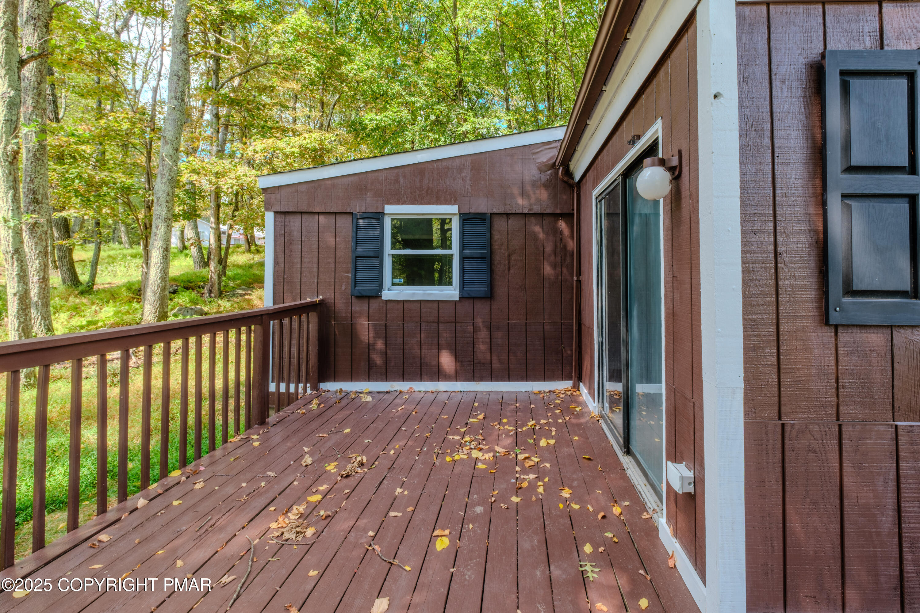 4774 Pine Ridge Drive West Bushkill, PA 18324 - Photo 14 of 36 a view of backyard with a deck and wooden floor