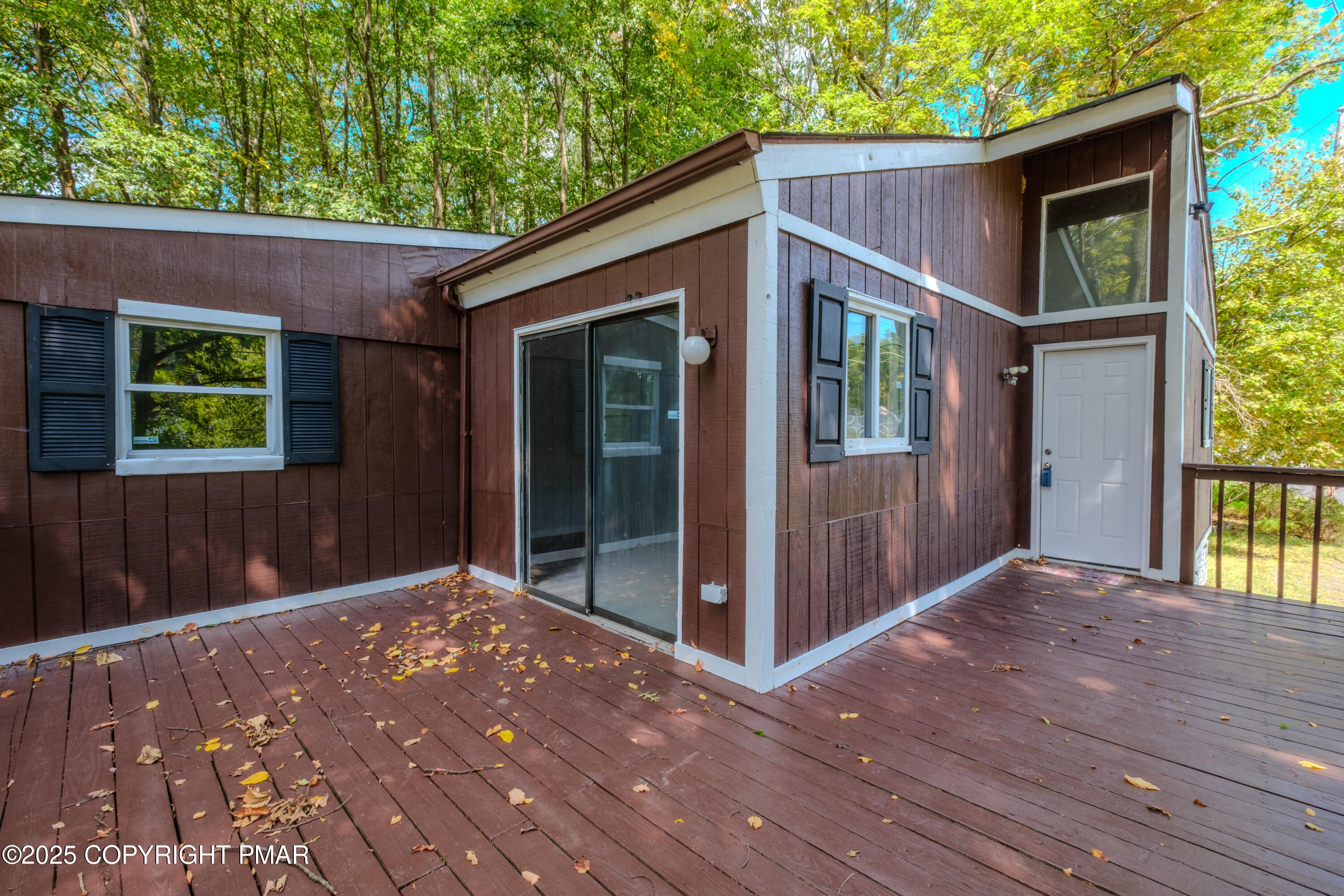 4774 Pine Ridge Drive West Bushkill, PA 18324 - Photo 15 of 36 a view of a house with a porch
