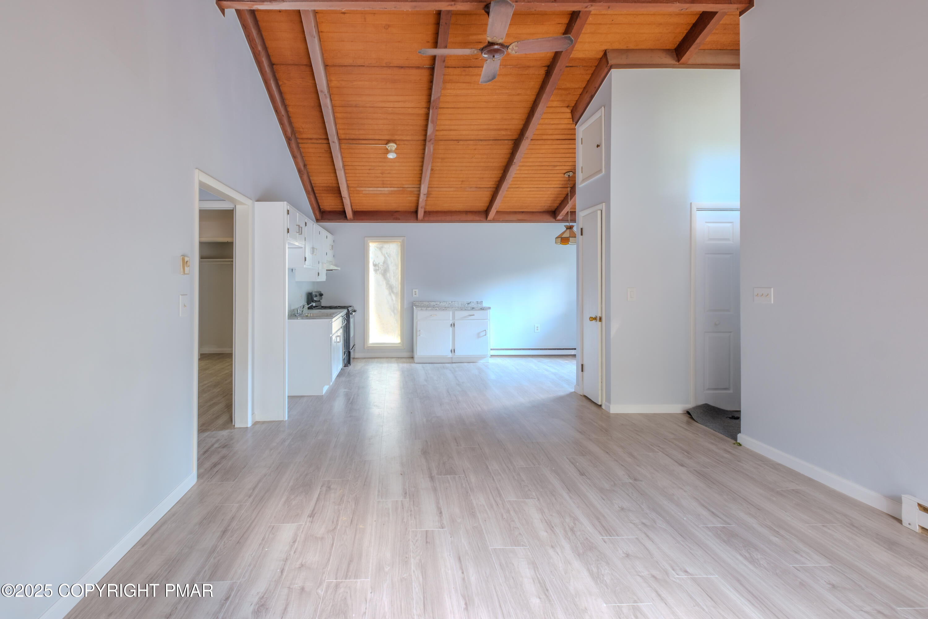 4774 Pine Ridge Drive West Bushkill, PA 18324 - Photo 17 of 36 a view of empty room with wooden floor