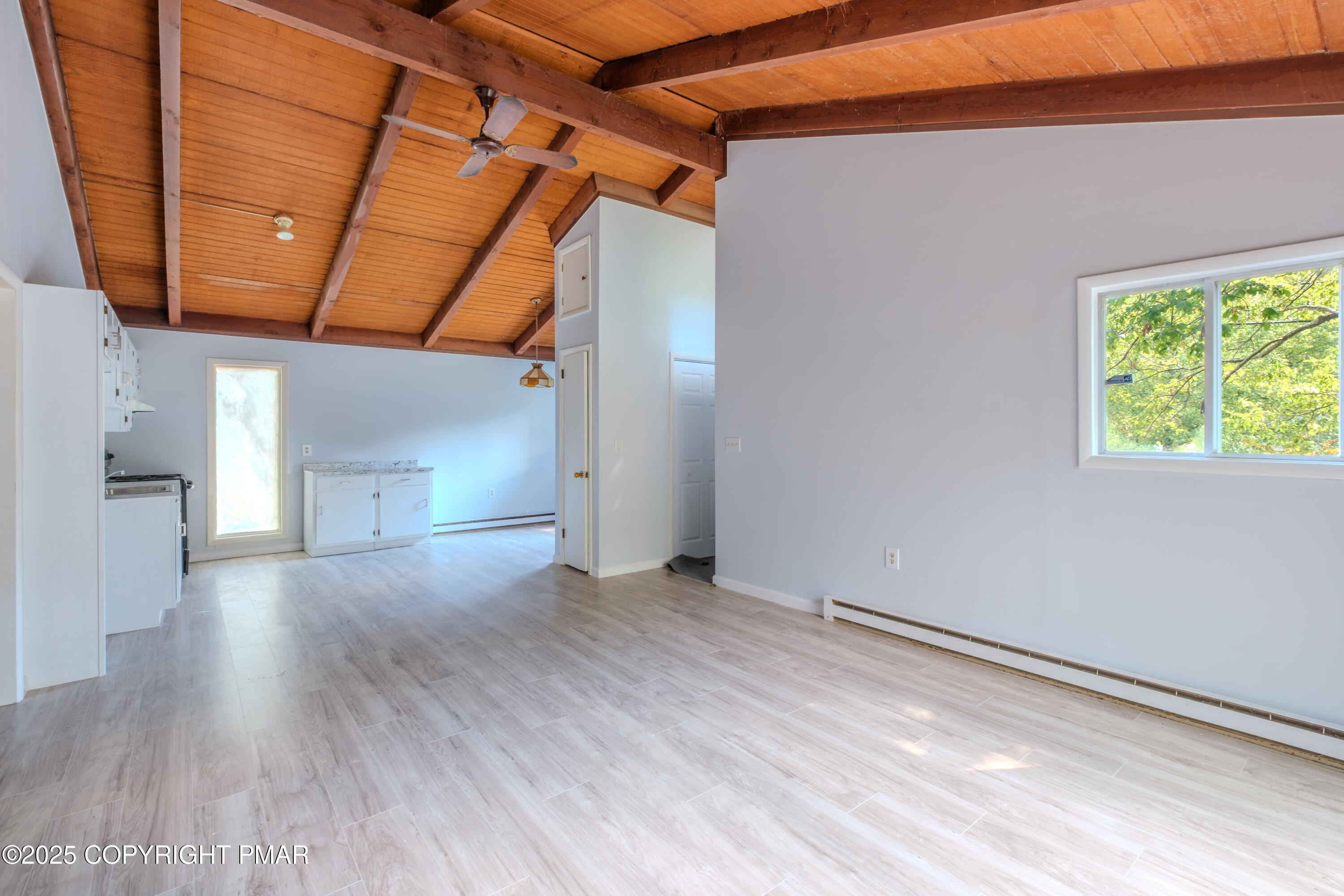4774 Pine Ridge Drive West Bushkill, PA 18324 - Photo 18 of 36 a view of a livingroom with wooden floor