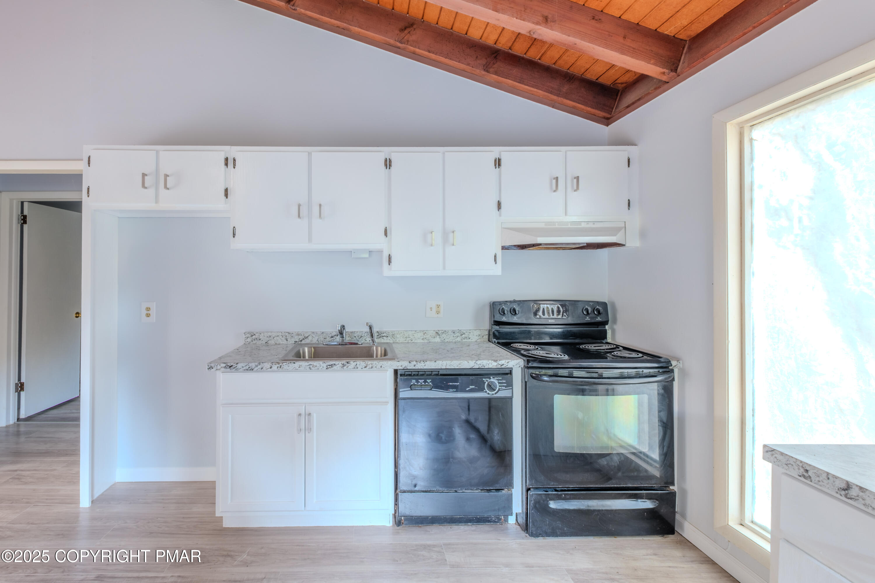 4774 Pine Ridge Drive West Bushkill, PA 18324 - Photo 20 of 36 a kitchen with a stove and a sink