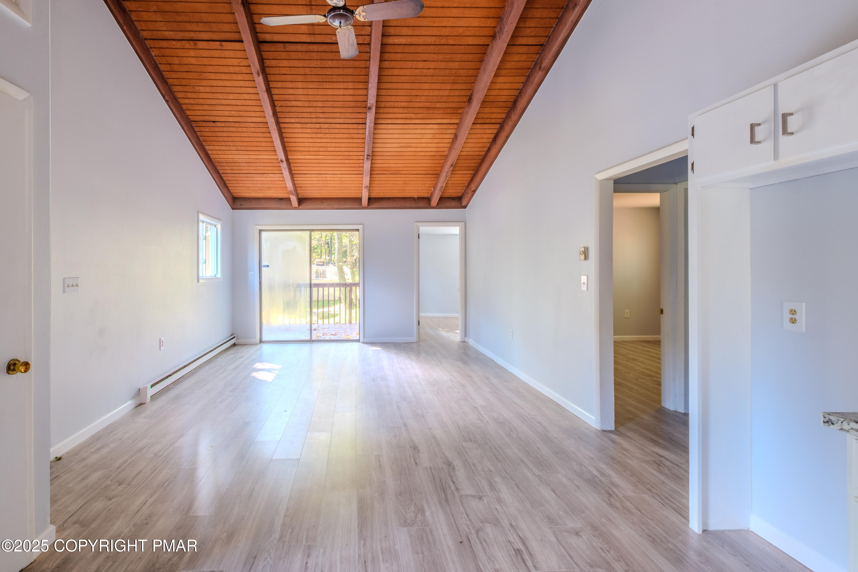 4774 Pine Ridge Drive West Bushkill, PA 18324 - Photo 21 of 36 a view of an empty room with wooden floor and a window