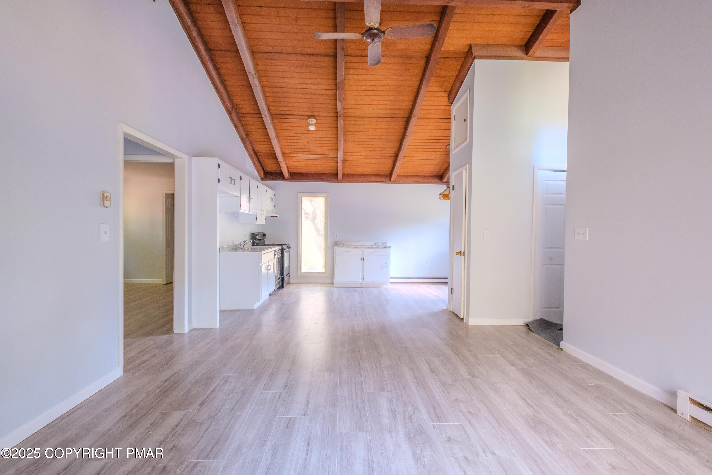 4774 Pine Ridge Drive West Bushkill, PA 18324 - Photo 28 of 36 a view of a hallway with wooden floor and staircase