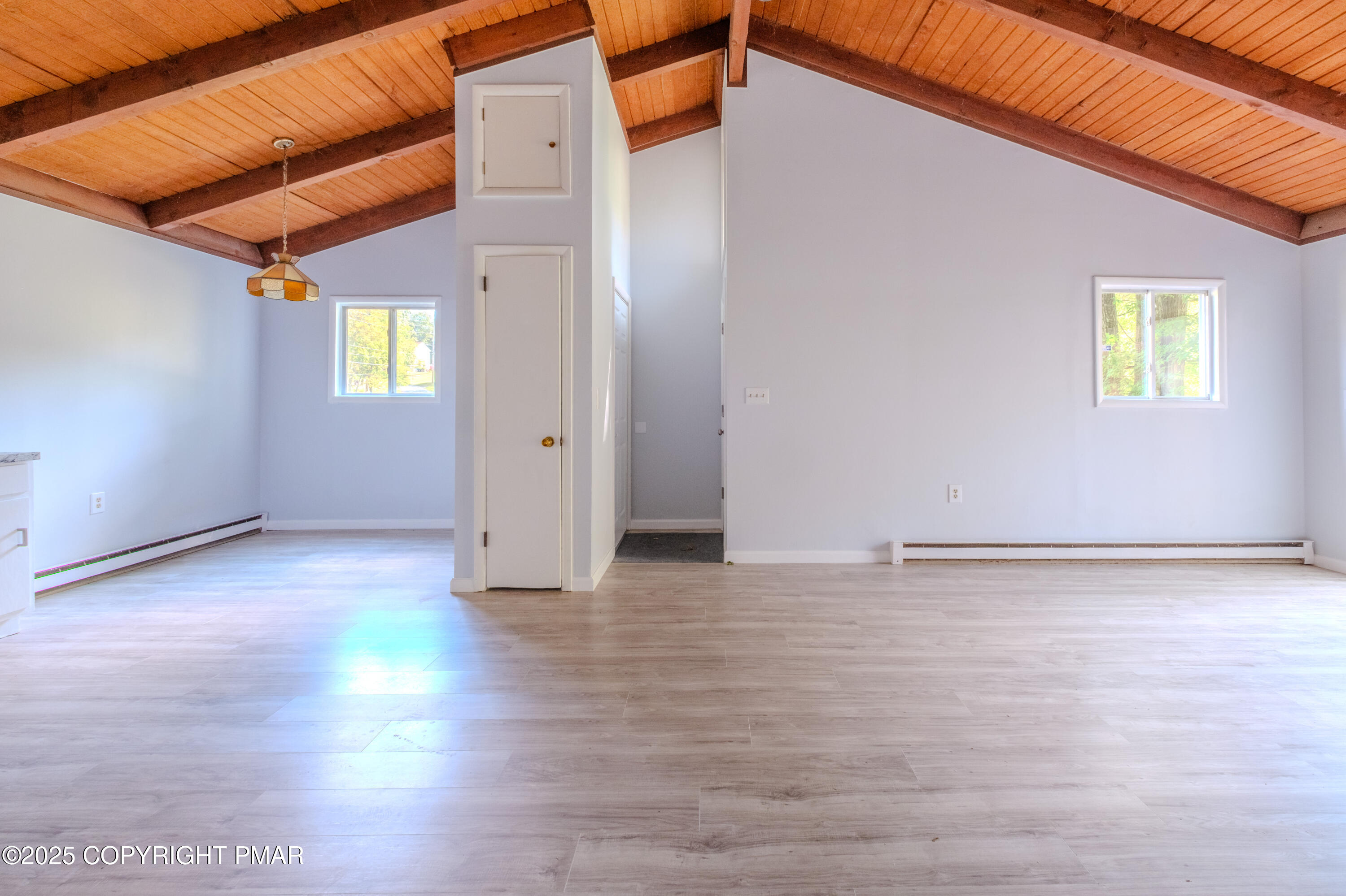 4774 Pine Ridge Drive West Bushkill, PA 18324 - Photo 29 of 36 a view of an empty room with wooden floor and a window