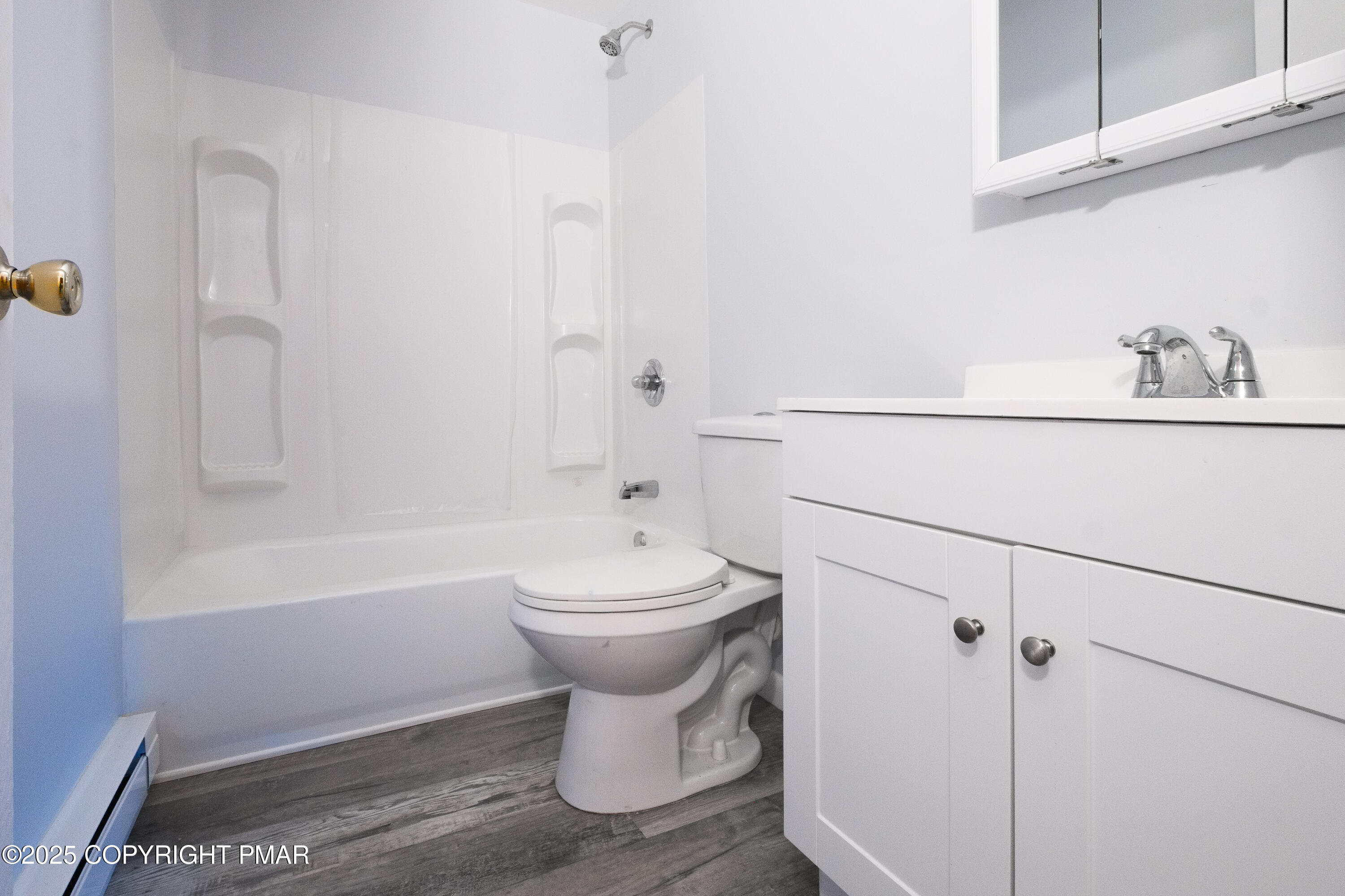 4774 Pine Ridge Drive West Bushkill, PA 18324 - Photo 31 of 36 a bathroom with a sink toilet and shower