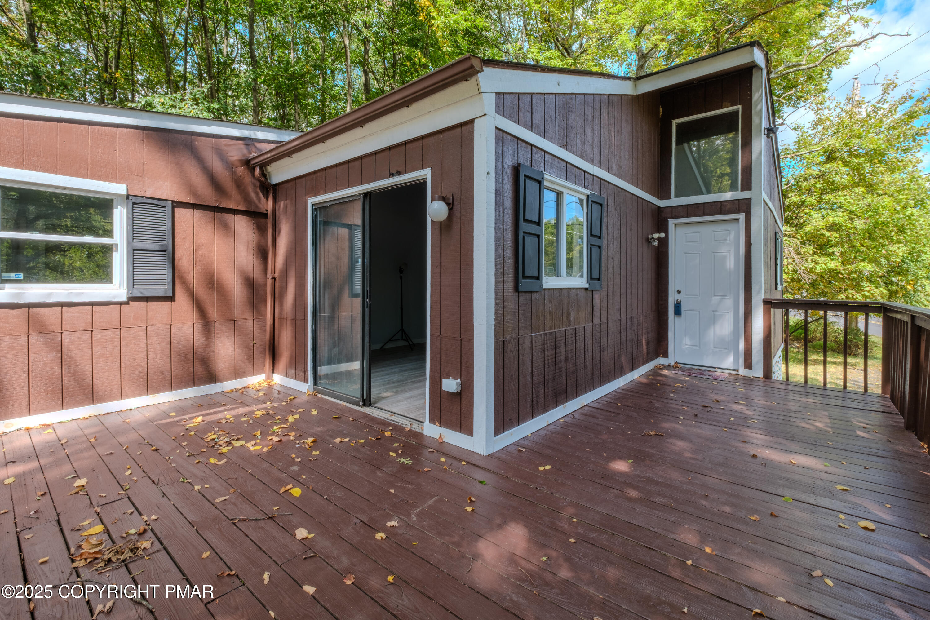 4774 Pine Ridge Drive West Bushkill, PA 18324 - Photo 34 of 36 a view of backyard with large tree and wooden fence