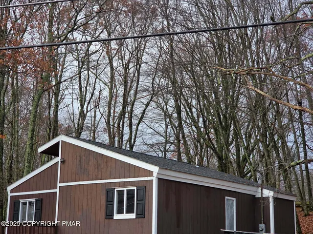 a aerial view of a house with a swimming pool