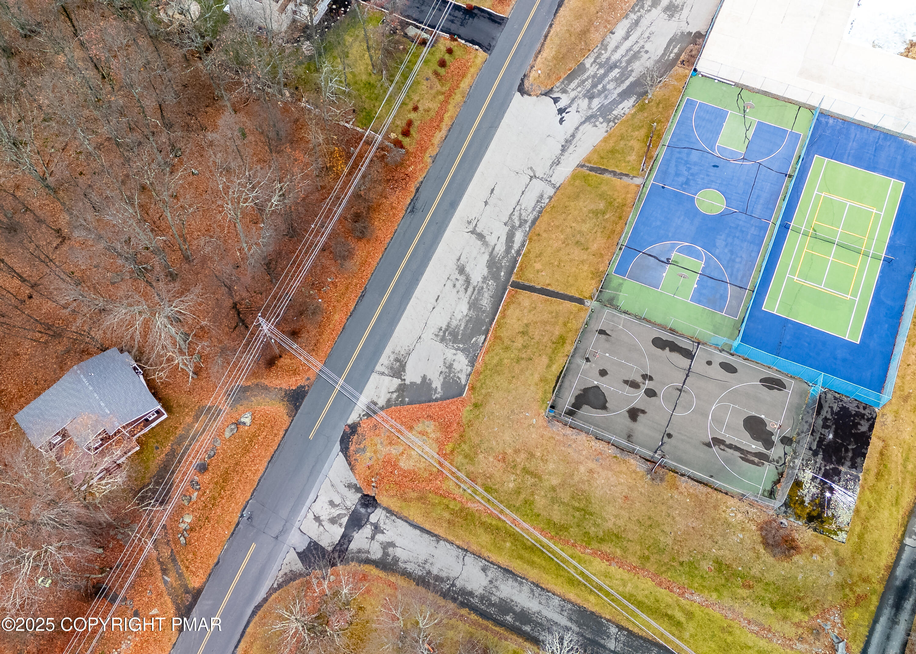 4774 Pine Ridge Drive West Bushkill, PA 18324 - Photo 36 of 36 a aerial view of a house with a swimming pool