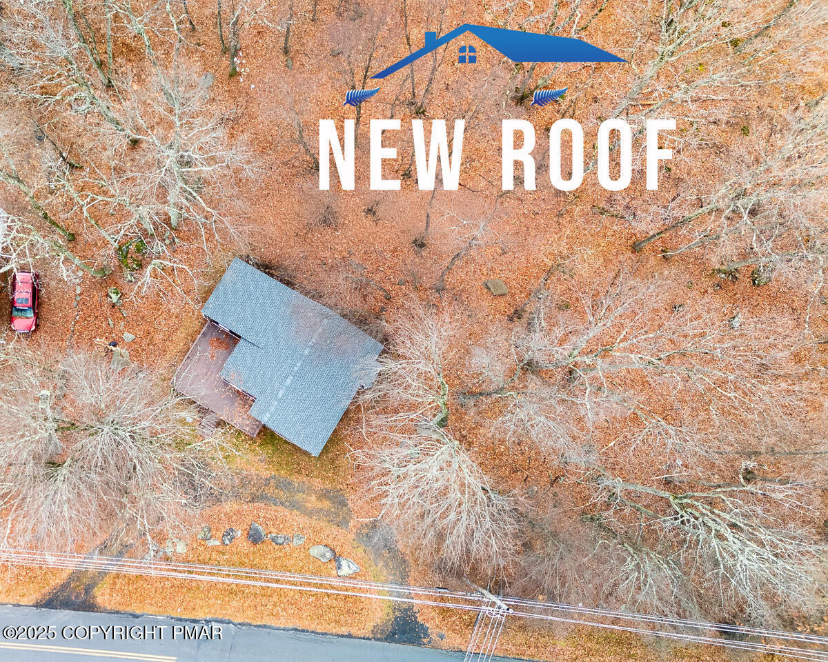 4774 Pine Ridge Drive West Bushkill, PA 18324 - Photo 4 of 36 a view of a wooden door