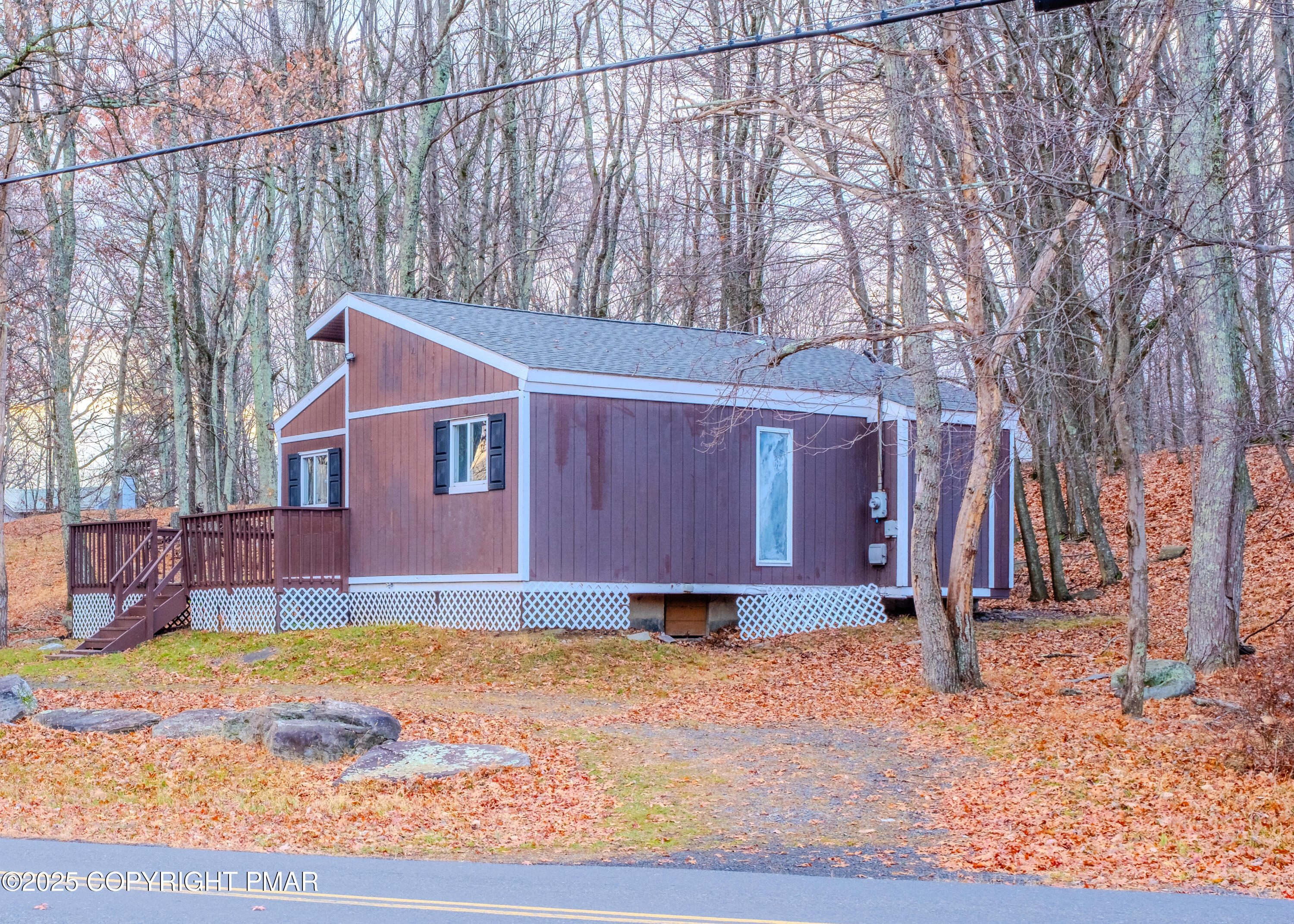 4774 Pine Ridge Drive West Bushkill, PA 18324 - Photo 8 of 36 a front view of a house with a yard