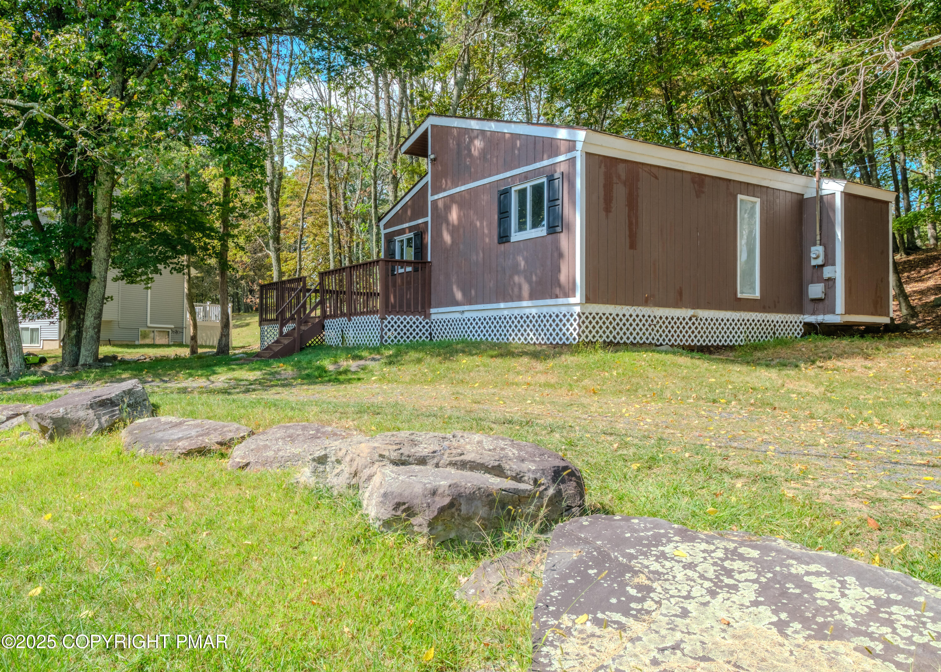 4774 Pine Ridge Drive West Bushkill, PA 18324 - Photo 10 of 36 a view of a backyard with large trees