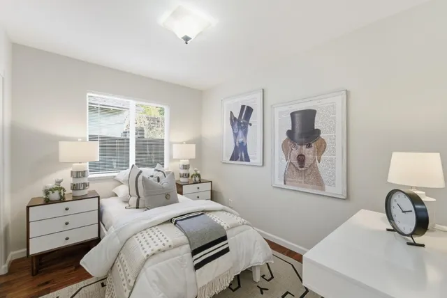 a bedroom with a bed and a couch