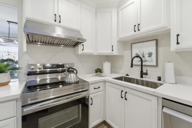 a kitchen with a stove and a sink