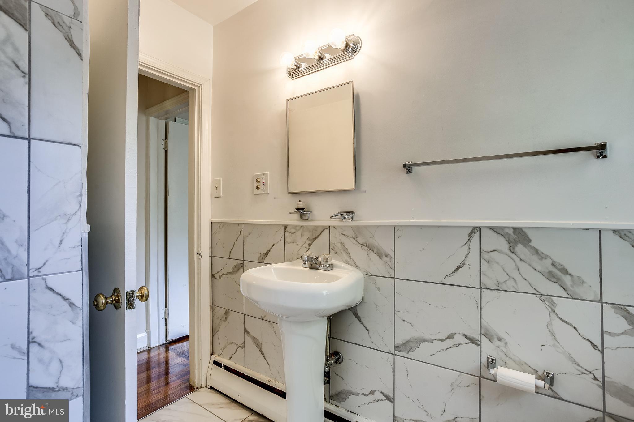3722 Chesholm Road Baltimore, MD 21216 - Photo 9 of 23 Hall bathroom