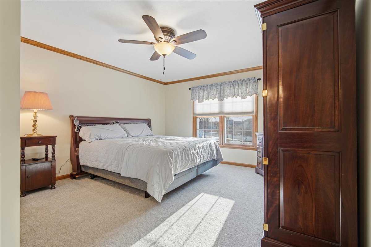 9 Spruce Court Bloomington, IL 61704 - Photo 19 of 42 a bedroom with a bed and window