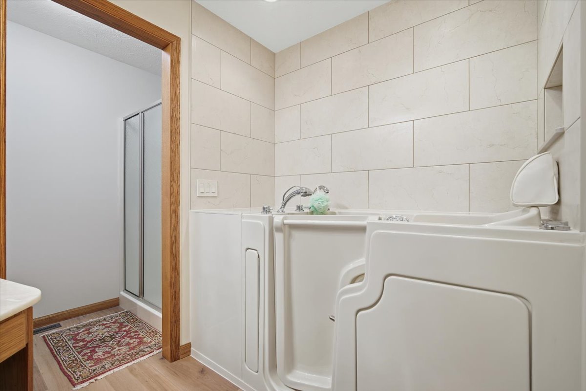 9 Spruce Court Bloomington, IL 61704 - Photo 21 of 42 a bathroom with a shower and vanity