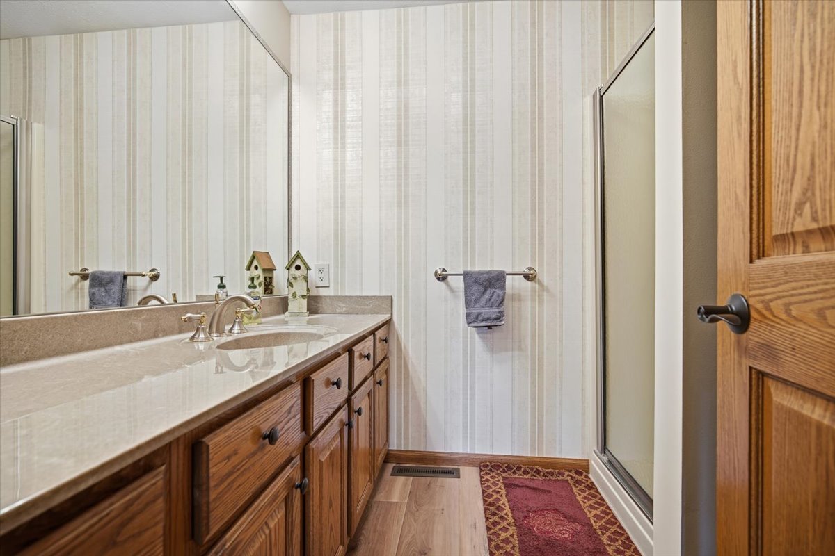 9 Spruce Court Bloomington, IL 61704 - Photo 23 of 42 a bathroom with a sink and a mirror