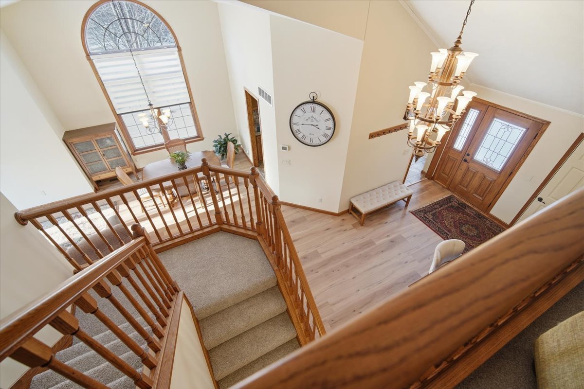 9 Spruce Court Bloomington, IL 61704 - Photo 24 of 42 a view of stairs and hall with wooden floor