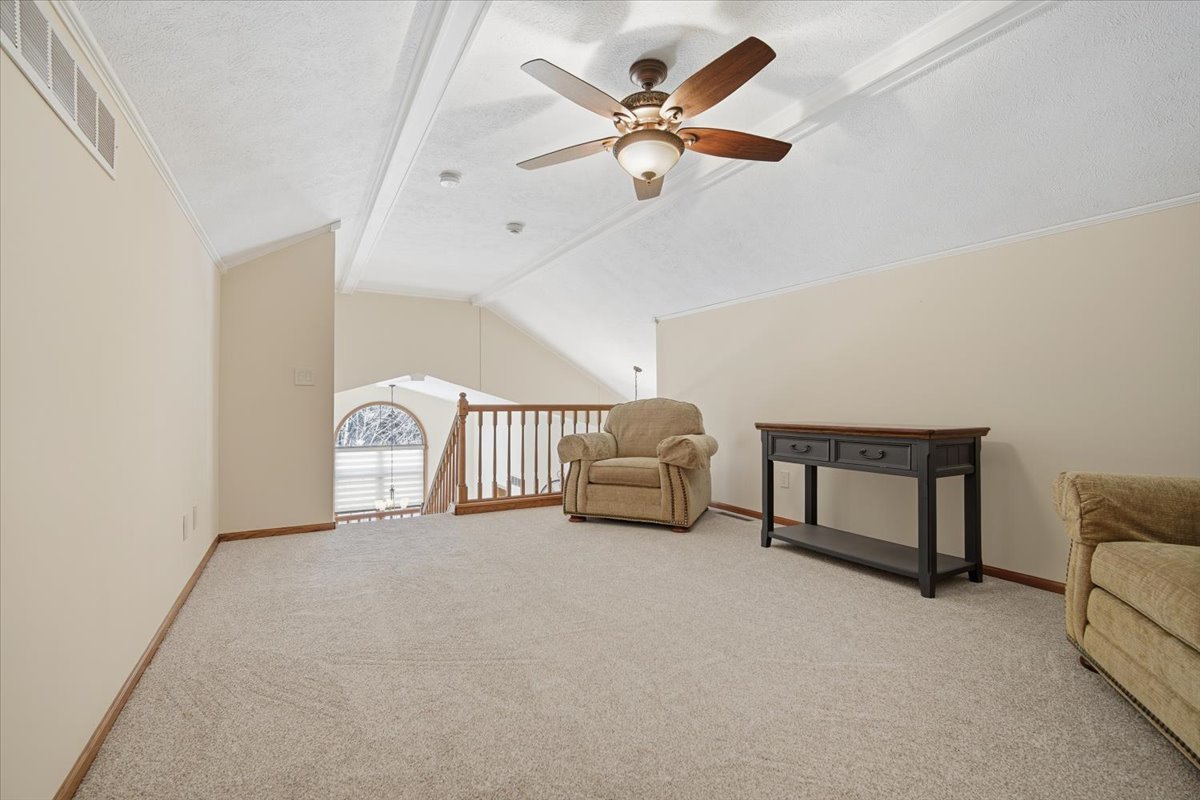 9 Spruce Court Bloomington, IL 61704 - Photo 27 of 42 a view of livingroom with furniture and ceiling fan