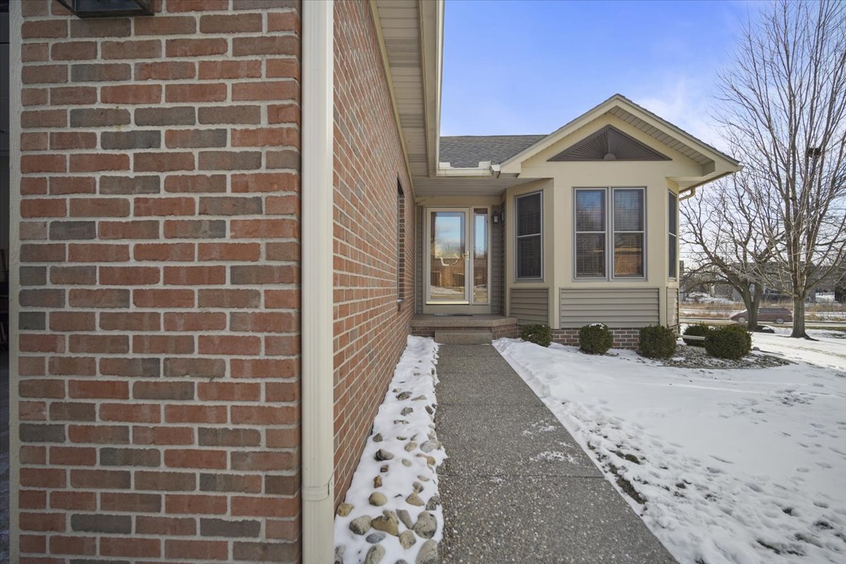 9 Spruce Court Bloomington, IL 61704 - Photo 3 of 42 a view of a brick house with a yard