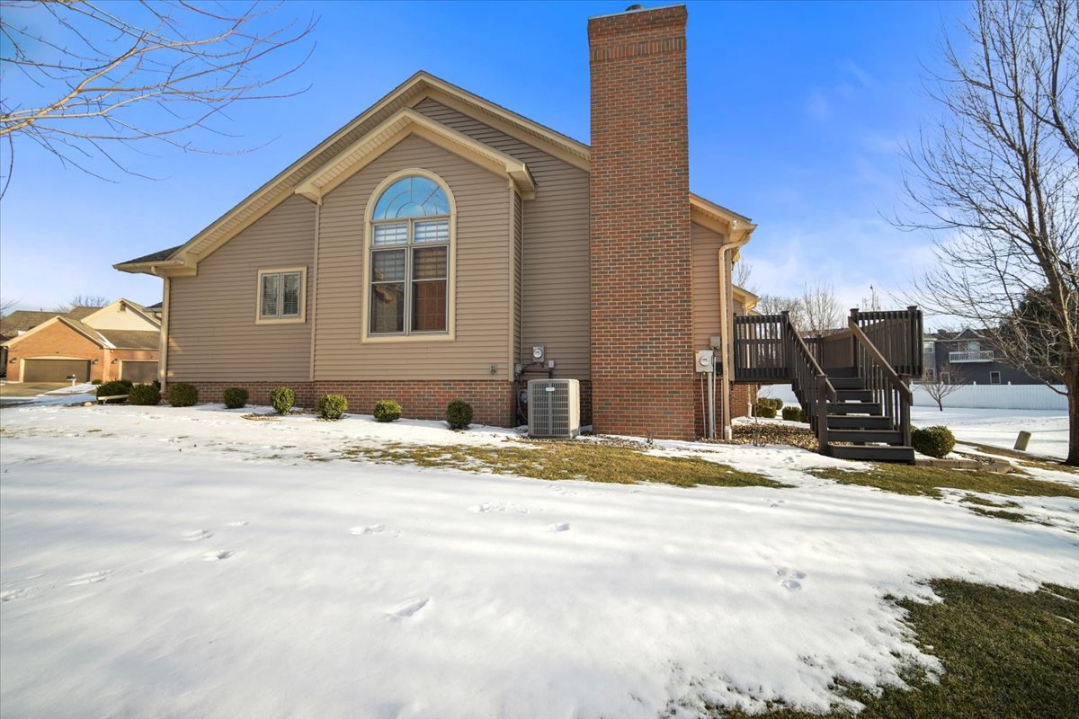 9 Spruce Court Bloomington, IL 61704 - Photo 41 of 42 a view of a house with snow on the background