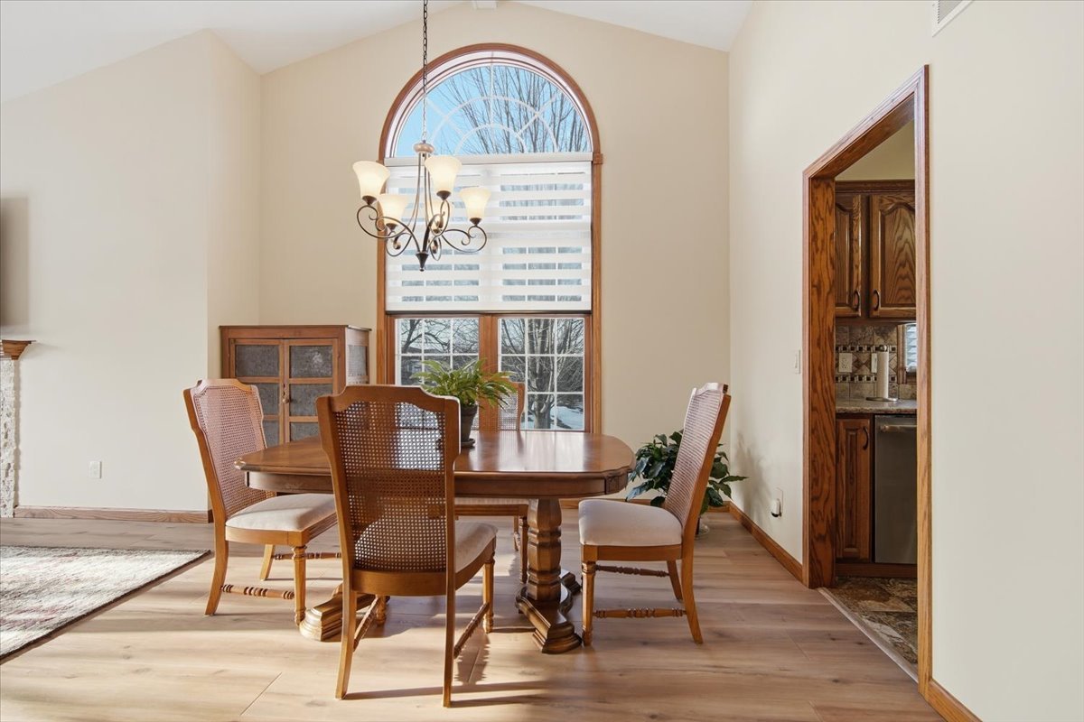 9 Spruce Court Bloomington, IL 61704 - Photo 10 of 42 a view of a dining room with furniture window and wooden floor
