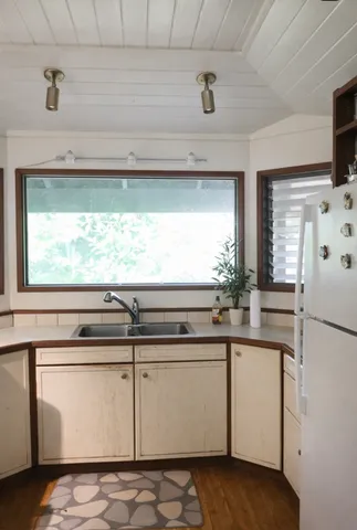a view of a kitchen with a sink and dishwasher
