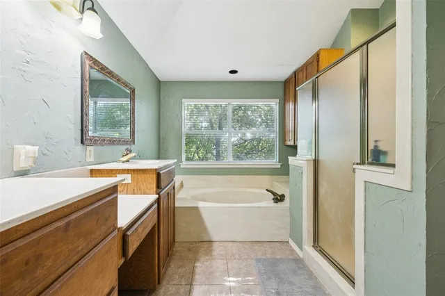 a bathroom with a bathtub and a sink