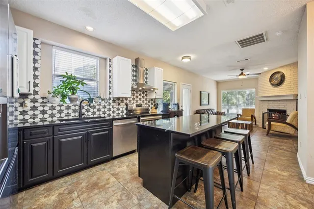 a kitchen with granite countertop lots of counter top space and dining table