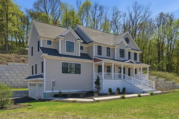 a house that has a big yard plants and large trees