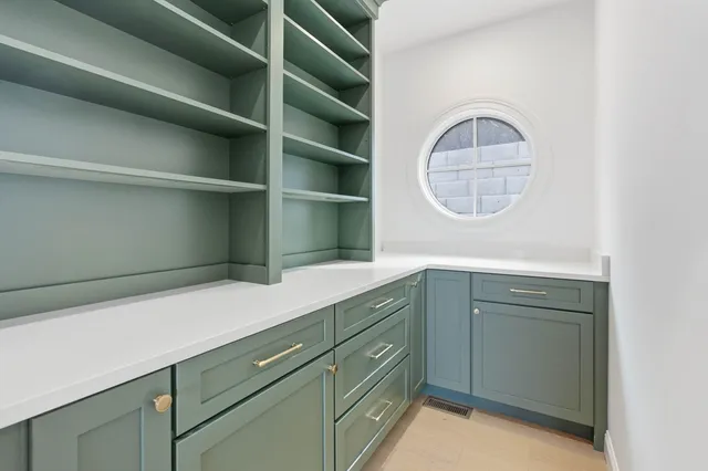 a hallway with cabinets and a wooden floors