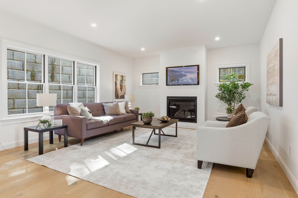 161 Bridge Street Hamilton, MA 01982 - Photo 15 of 42 a living room with furniture and a fireplace
