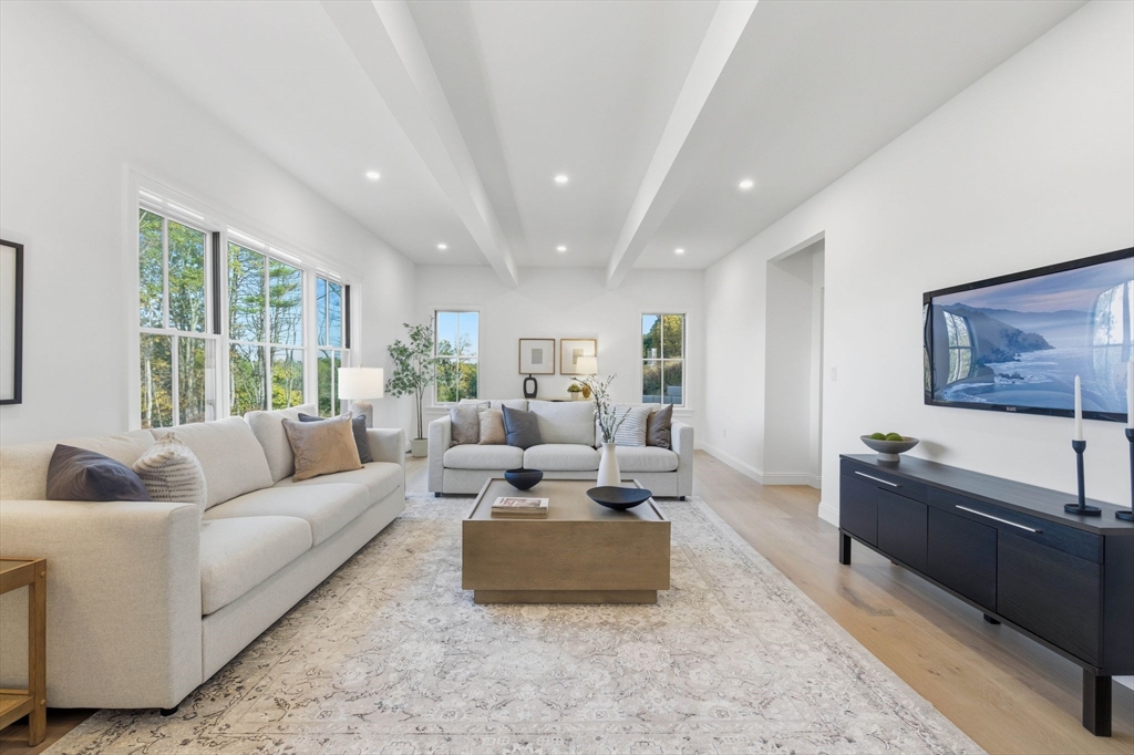 161 Bridge Street Hamilton, MA 01982 - Photo 19 of 42 a living room with furniture and a large window