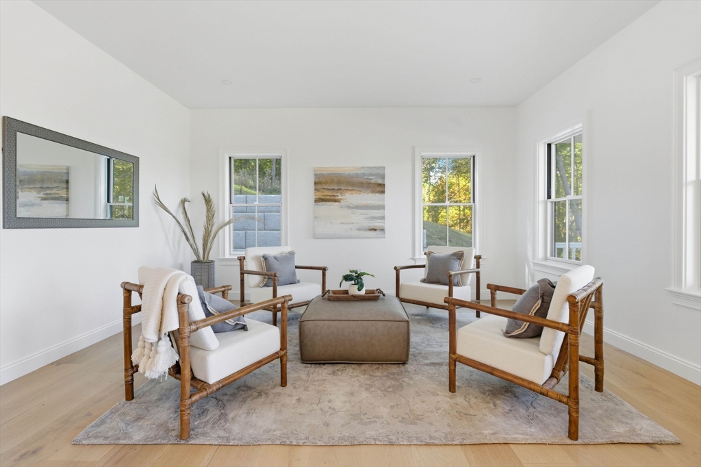 161 Bridge Street Hamilton, MA 01982 - Photo 22 of 42 a living room with furniture and a large window