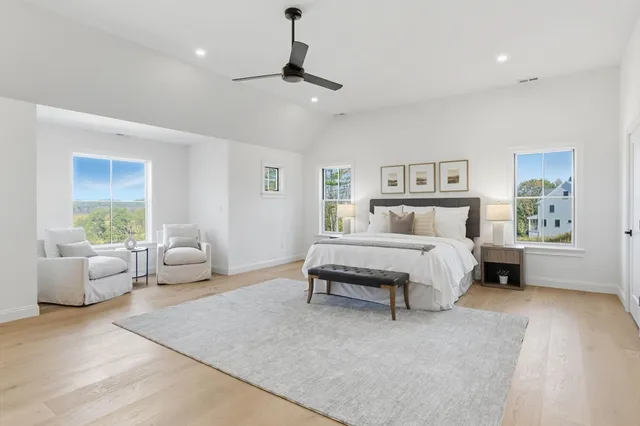 a bedroom with a large bed and furniture