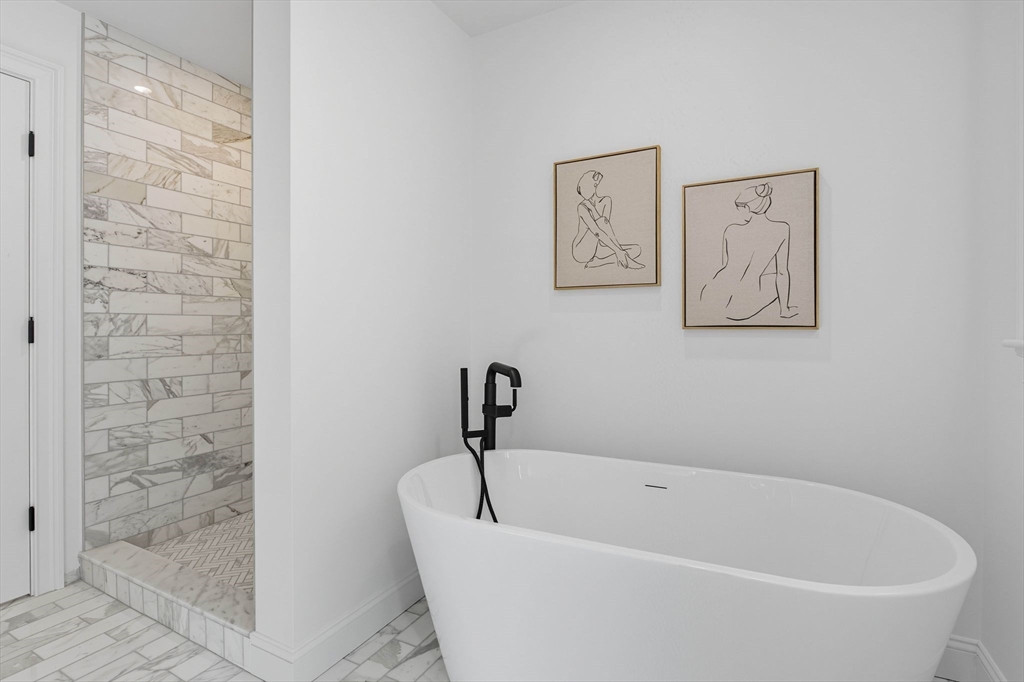 161 Bridge Street Hamilton, MA 01982 - Photo 28 of 42 a white bath tub sitting next to a shower