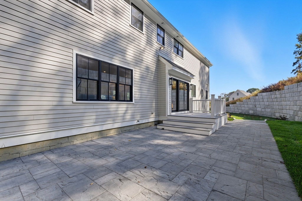 161 Bridge Street Hamilton, MA 01982 - Photo 3 of 42 a view of a house with a small yard and large tree