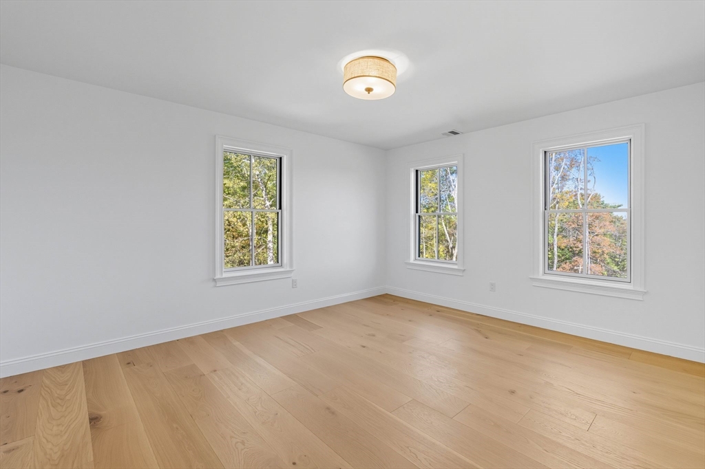 161 Bridge Street Hamilton, MA 01982 - Photo 31 of 42 a view of an empty room with a window and closet area