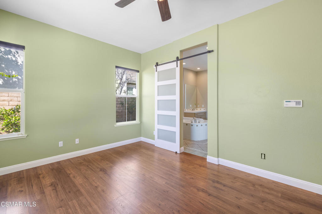 4920 Corral Street Simi Valley, CA 93063 - Photo 18 of 54 an empty room with wooden floor and windows
