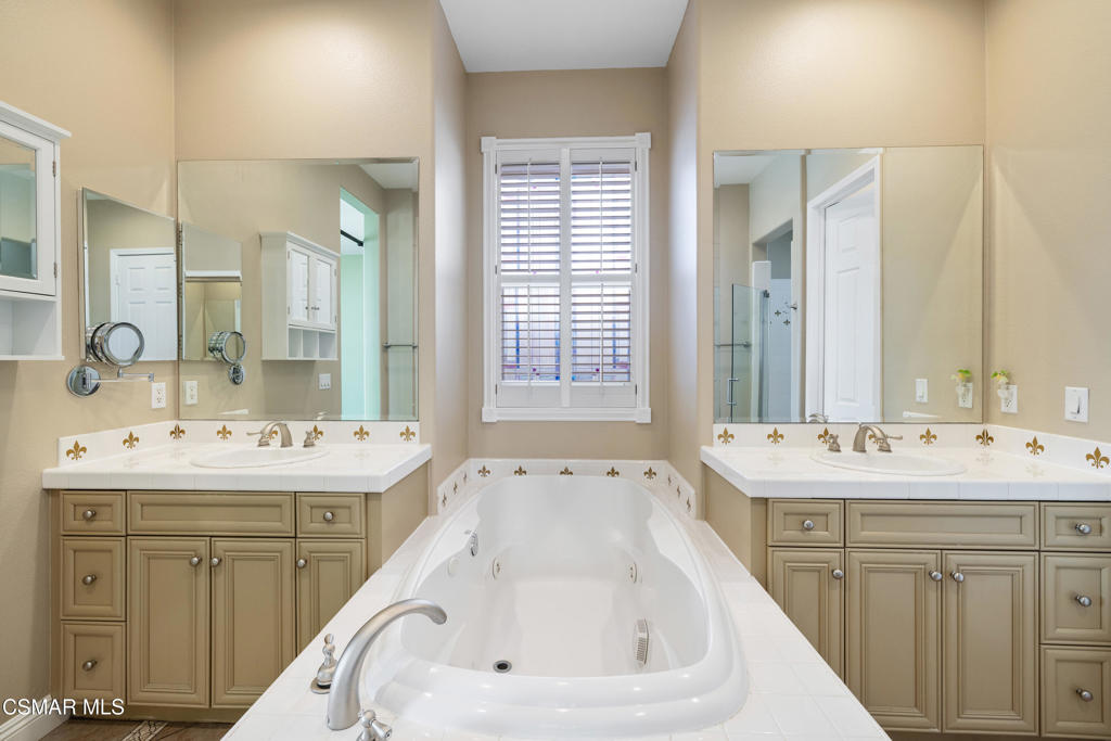 4920 Corral Street Simi Valley, CA 93063 - Photo 20 of 54 a bathroom with a sink double vanity and a bathtub