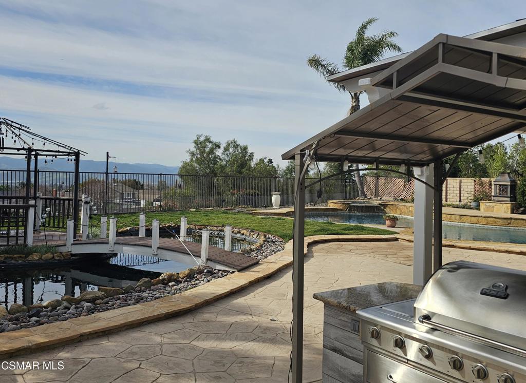 4920 Corral Street Simi Valley, CA 93063 - Photo 2 of 54 a roof deck with table and chairs